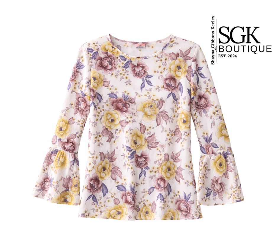 Floral-patterned long-sleeve top on a white background with SGK Boutique branding.