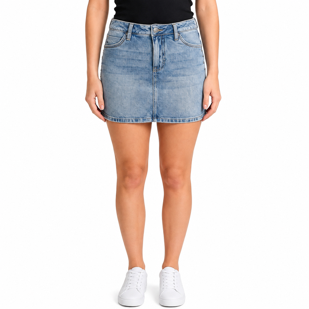 Person wearing a light blue denim skirt on a white background