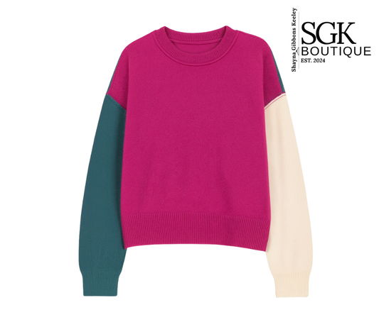 Color-blocked sweater with pink, green, and beige sleeves on a white background, featuring the SGK Boutique logo.