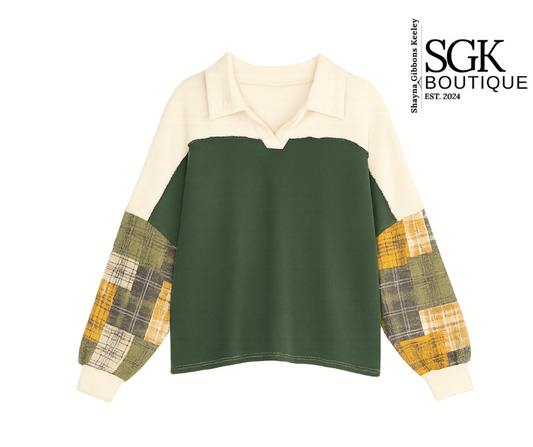 Green and beige sweater with plaid sleeves on a white background, featuring SGK Boutique logo.