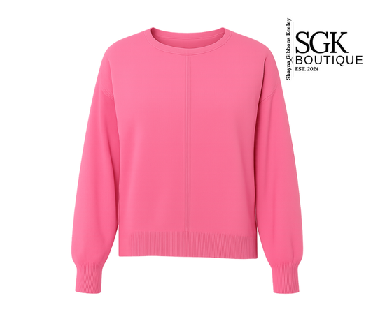 Pink sweater on a white background with SGK Boutique logo.