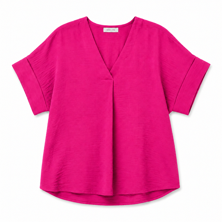 A bright pink short-sleeve V-neck top with a relaxed, draped silhouette and a subtle crinkle texture, shown flat on a white background.