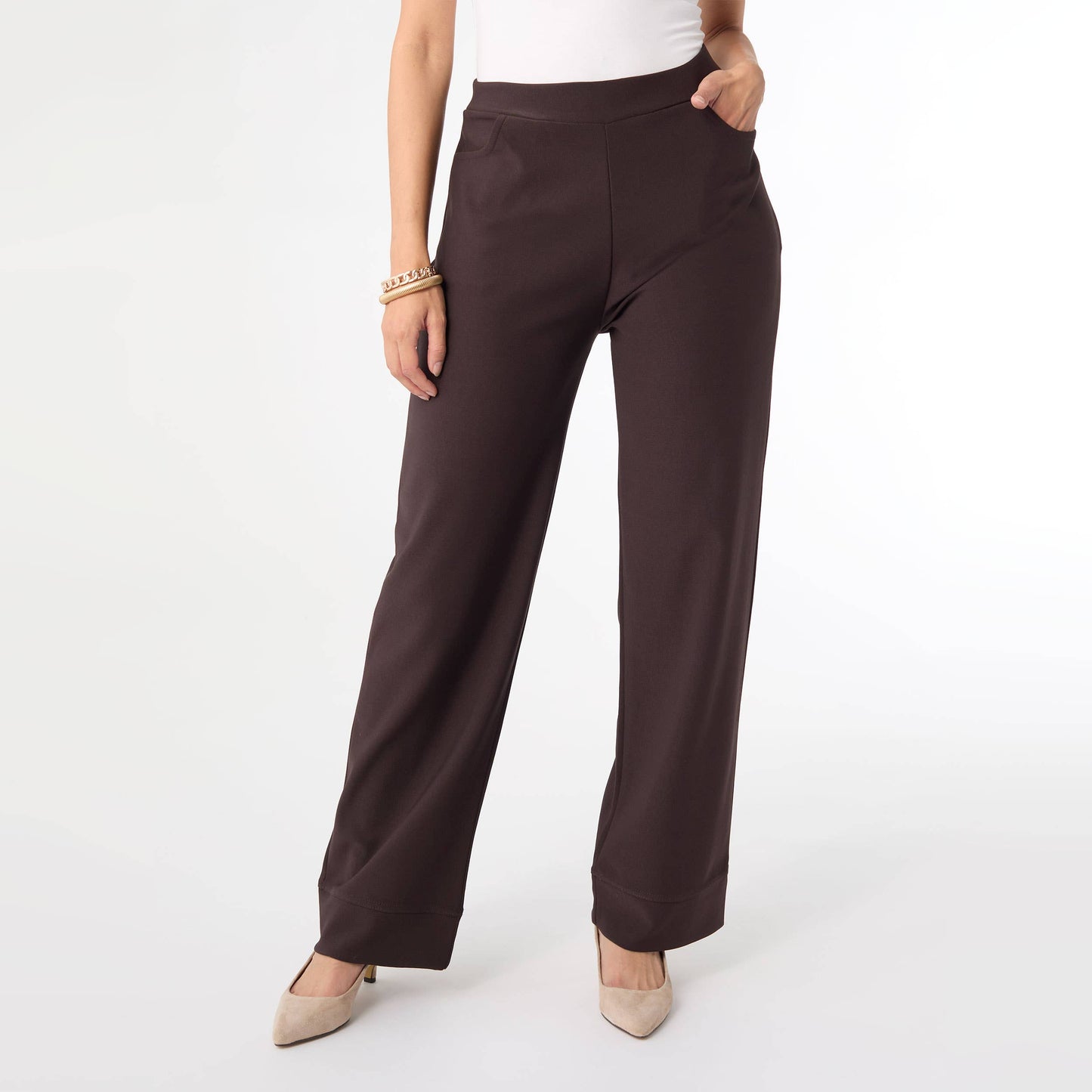 Brown pants worn by a person on a white background