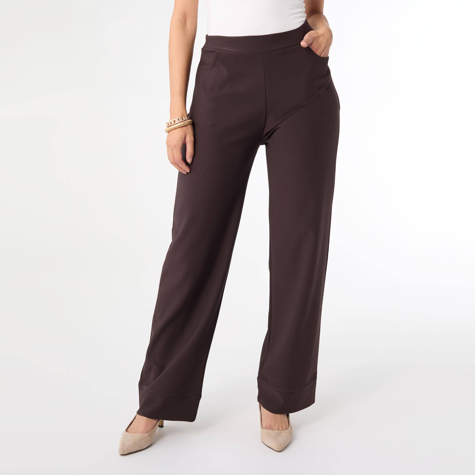 Brown pants worn by a person on a white background