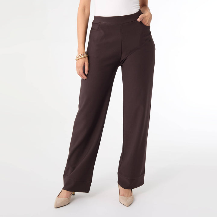 Brown pants worn by a person on a white background