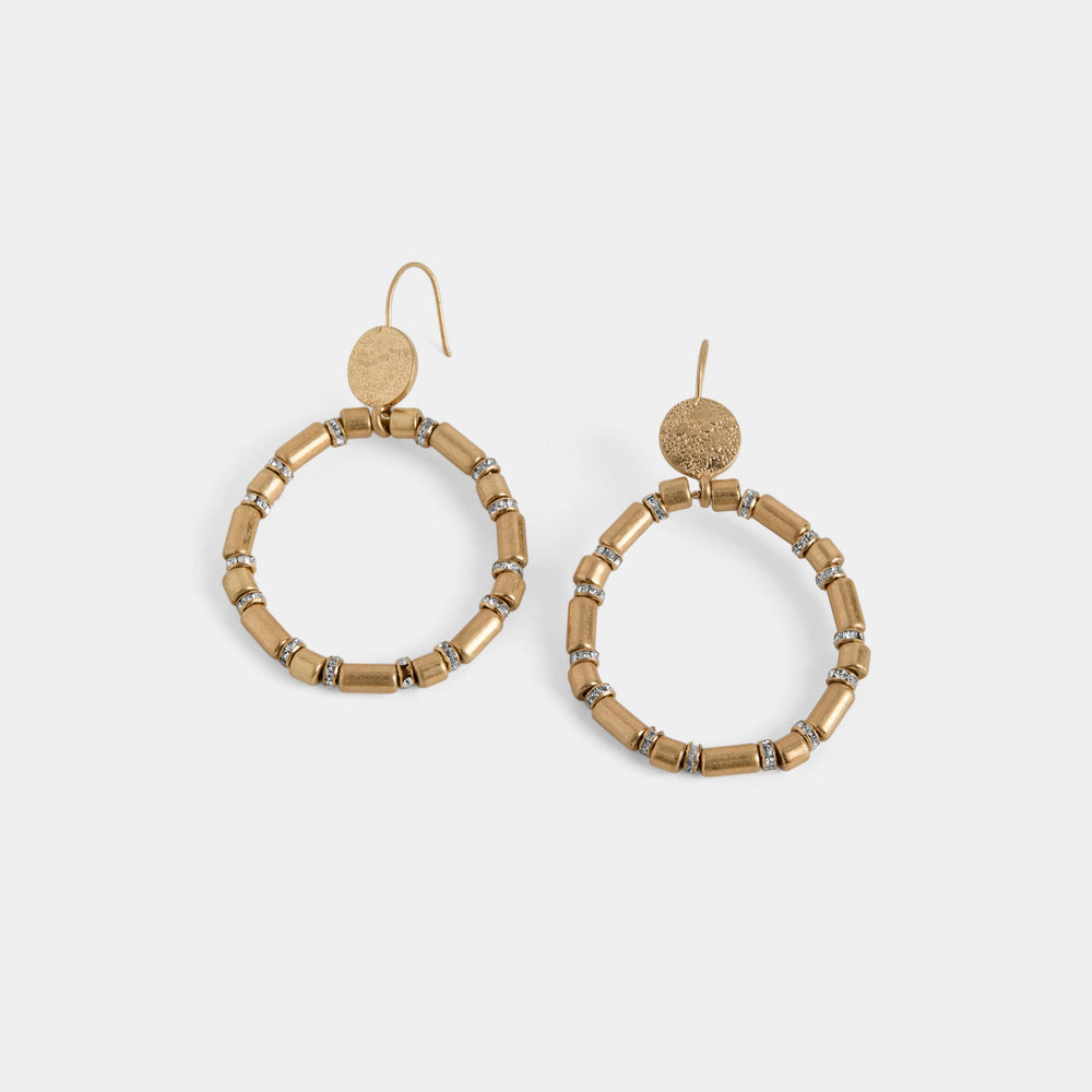 Pair of gold hoop earrings with beaded detailing on a white background