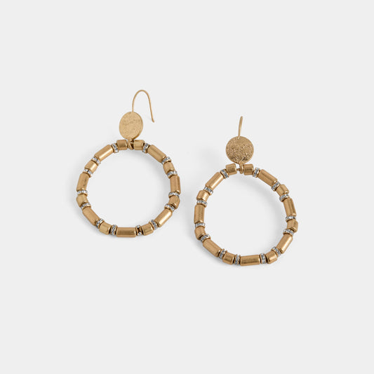 Pair of gold hoop earrings with beaded detailing on a white background