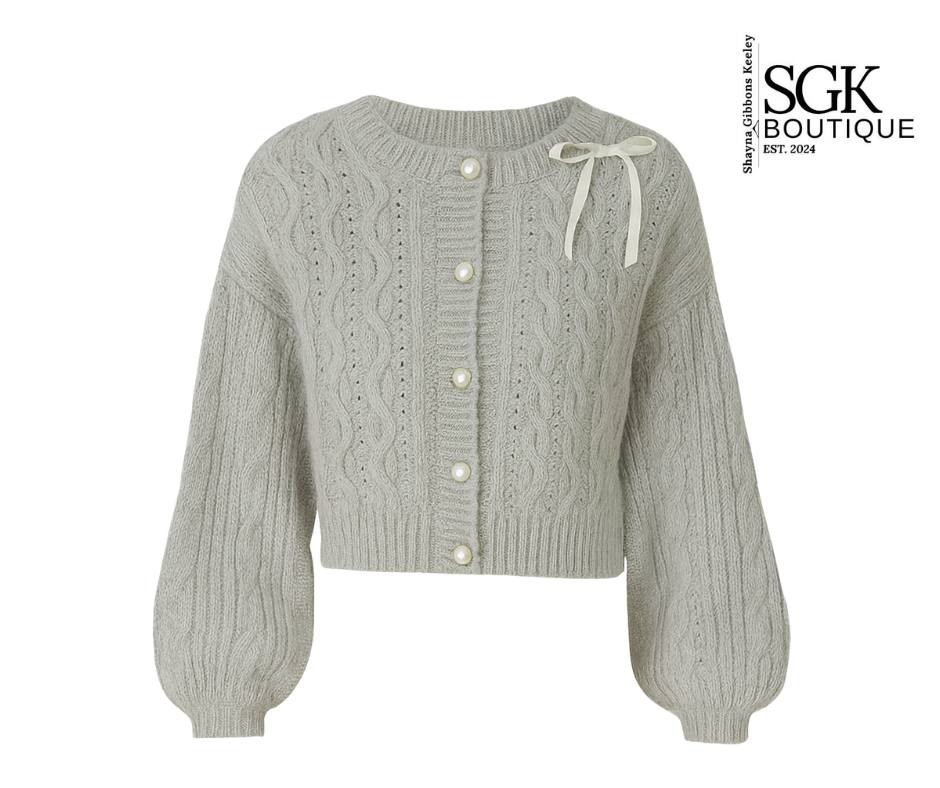 Gray knit cardigan with cable patterns on a white background, featuring SGK Boutique logo.