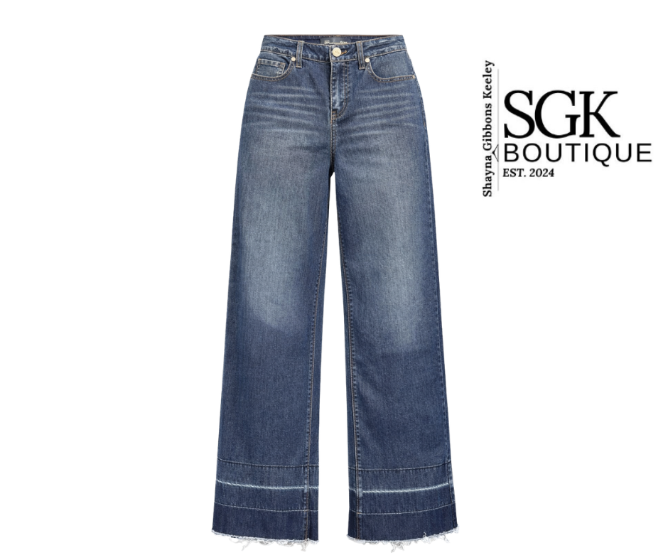 Blue jeans with a white background and SGK Boutique logo.