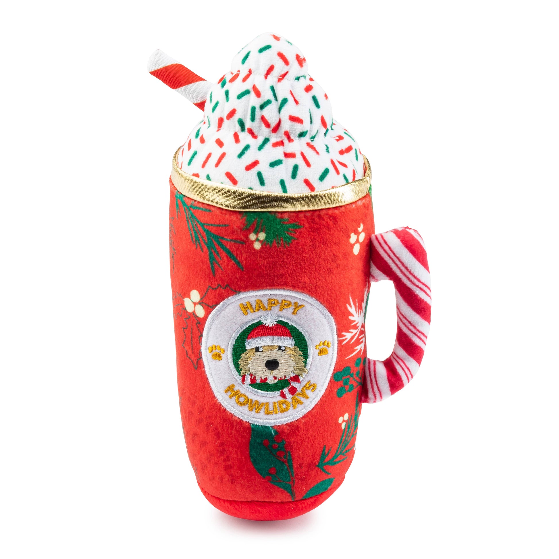 Red mug with Christmas design, filled with a toy resembling a hot chocolate with whipped cream and a candy cane.
