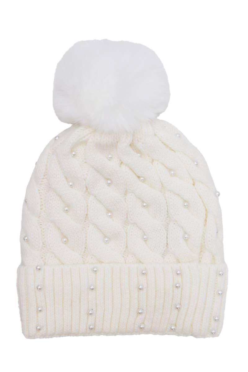 White knit beanie with a pom-pom on a white background