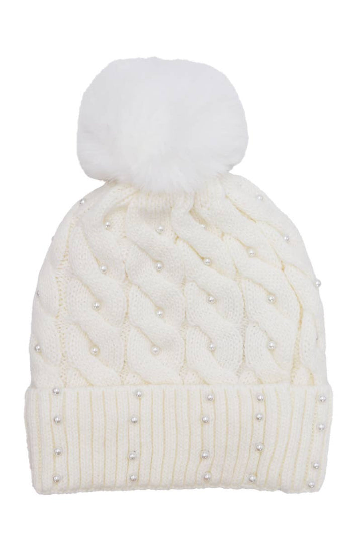 White knit beanie with a pom-pom on a white background