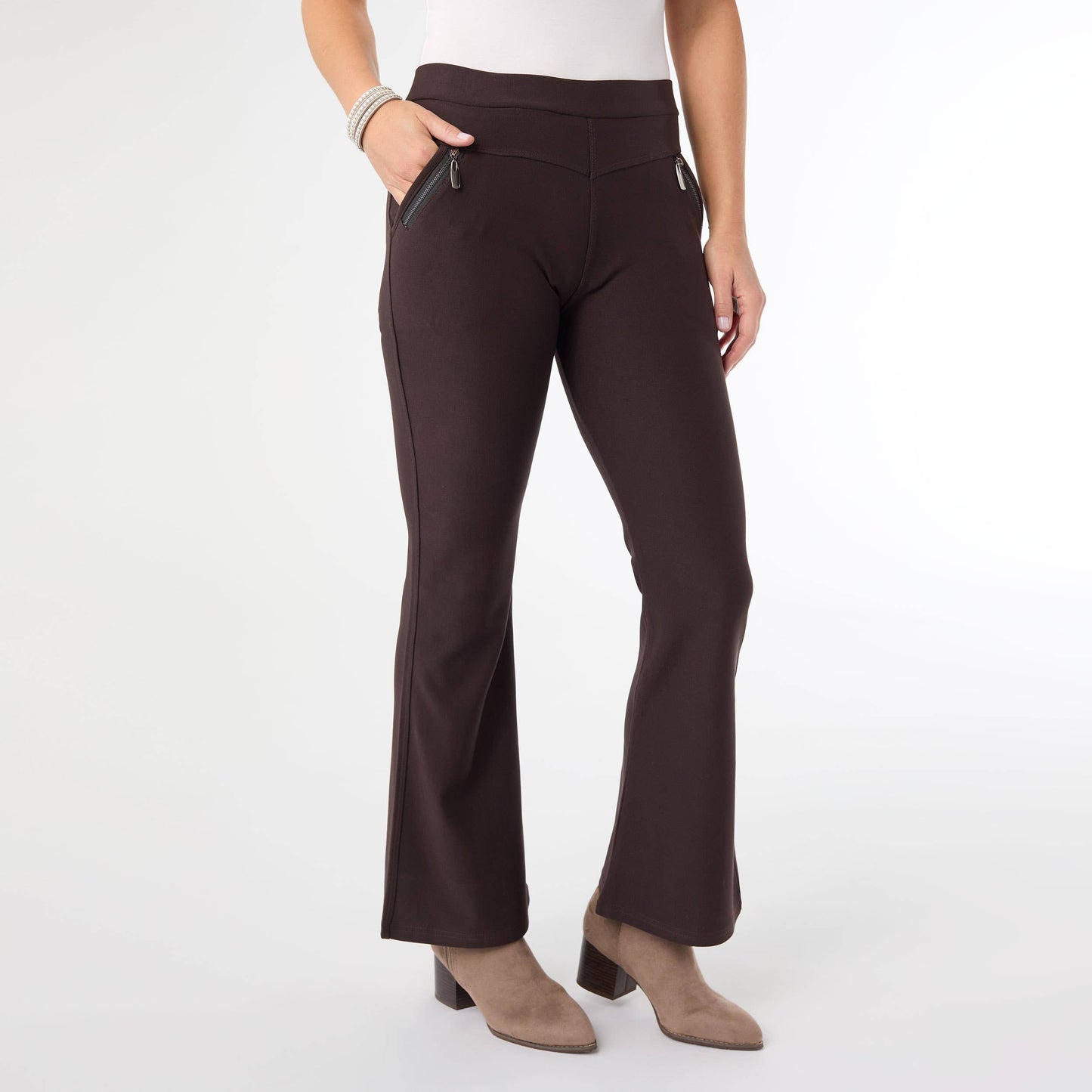 Brown pants worn by a person on a white background