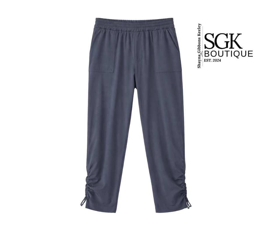 Gray pants on a white background with SGK Boutique logo.