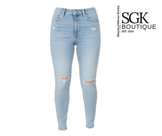 Light blue jeans with distressed details on a white background, featuring the SGK Boutique logo.