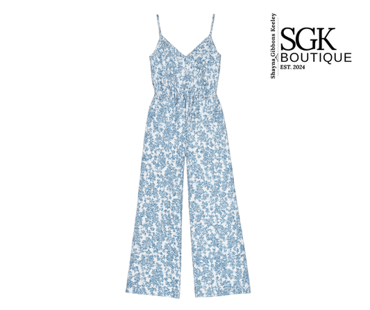 Blue floral jumpsuit on a white background with SGK Boutique branding.