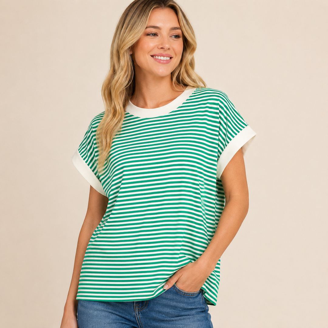 Woman wearing a green and white striped shirt on a beige background