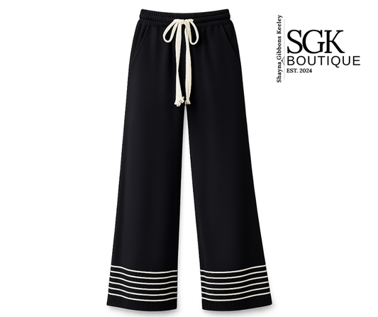 Black wide-leg pants with white drawstring and trim on a white background, featuring SGK Boutique logo.