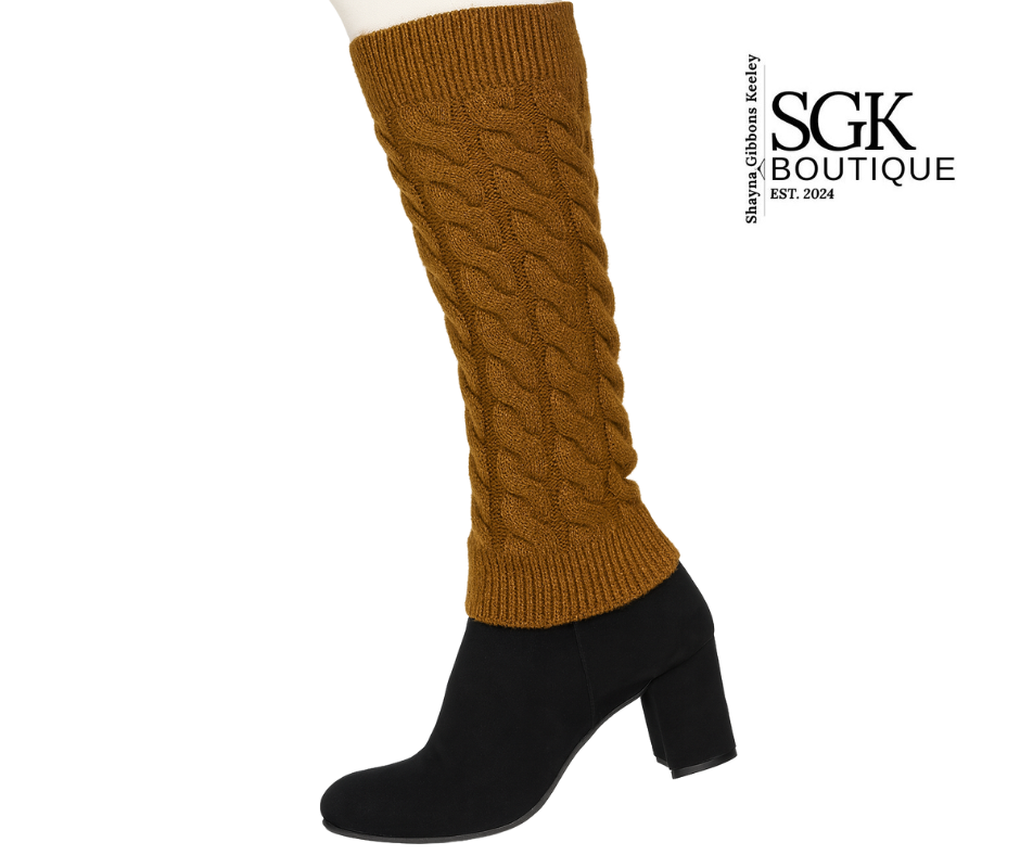 Brown knitted leg warmers over black boots on a white background with SGK Boutique logo.