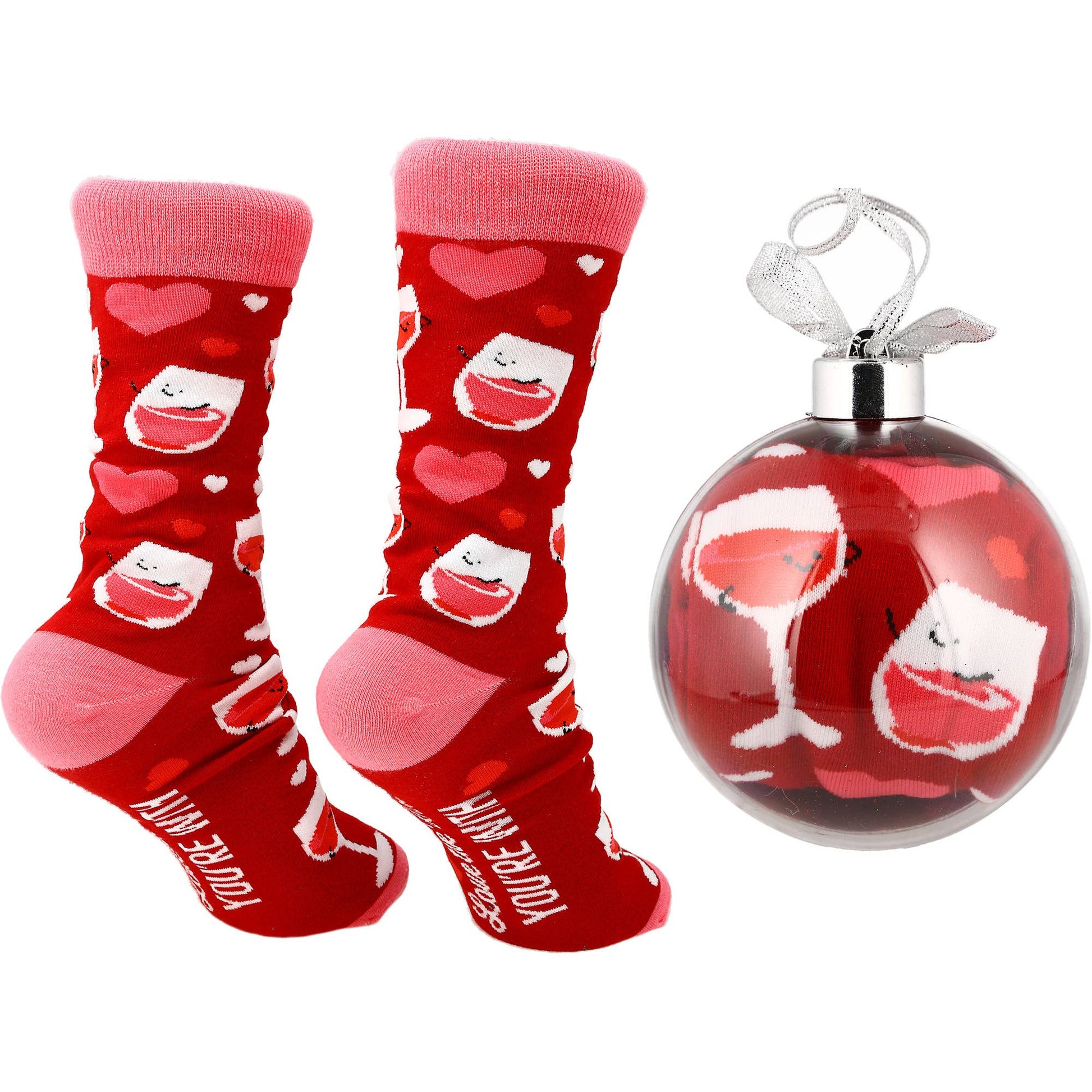 Red socks with heart and face designs and a matching ornament on a white background