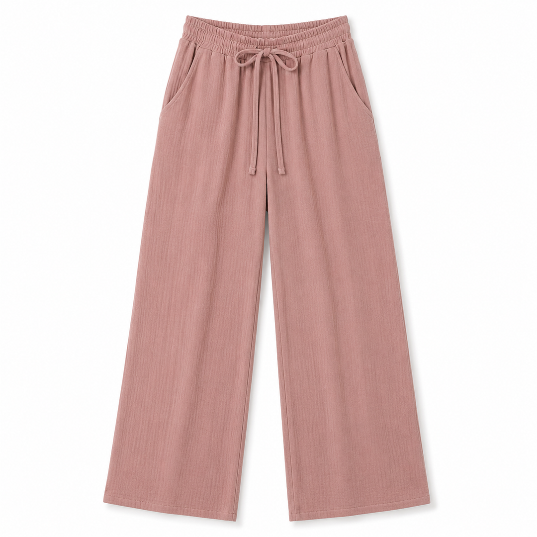 A pair of dusty rose wide-leg pants with an elastic waistband and drawstring, displayed flat against a solid white background.