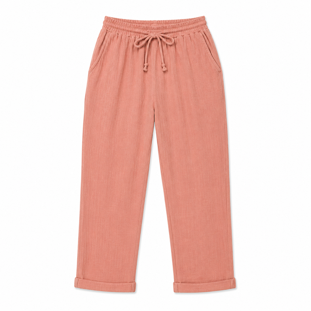 Pink pants with drawstring waist on a white background