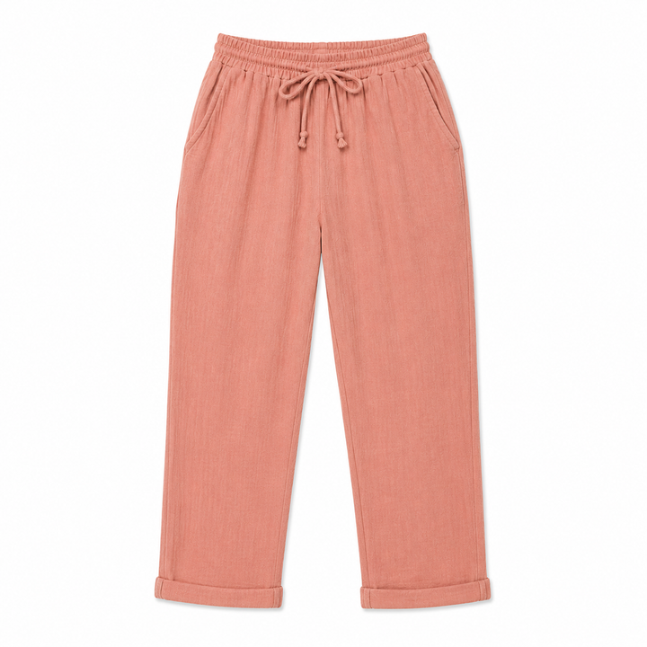 Pink pants with drawstring waist on a white background