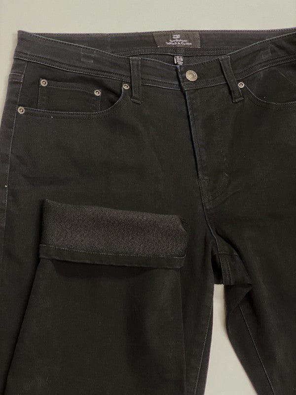 Black pants with cargo pockets on a light gray background