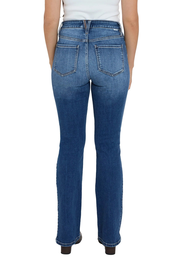 Blue jeans worn by a person on a white background
