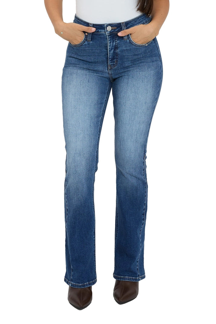 Blue jeans worn by a person on a white background