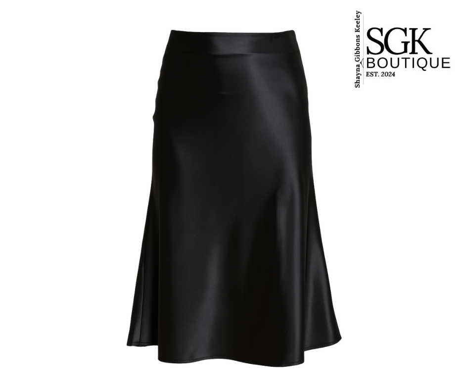 Black satin skirt on a white background with SGK Boutique logo.