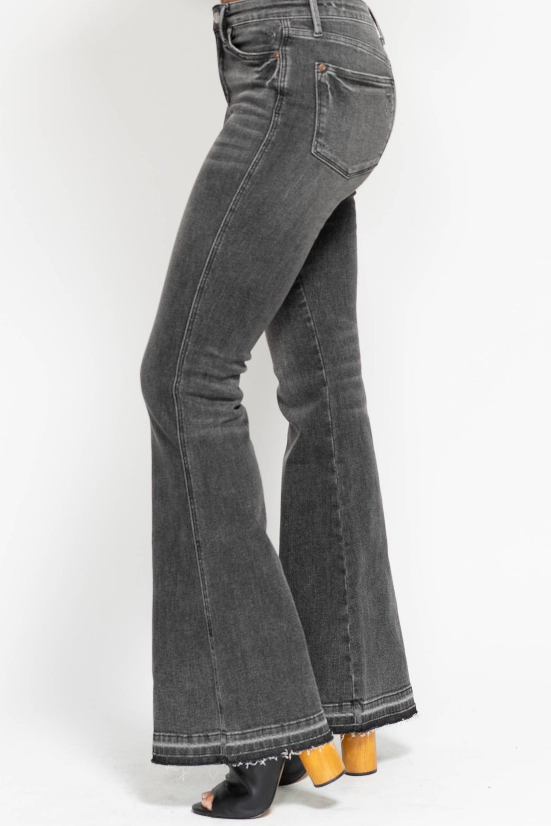 Gray flared jeans on a white background