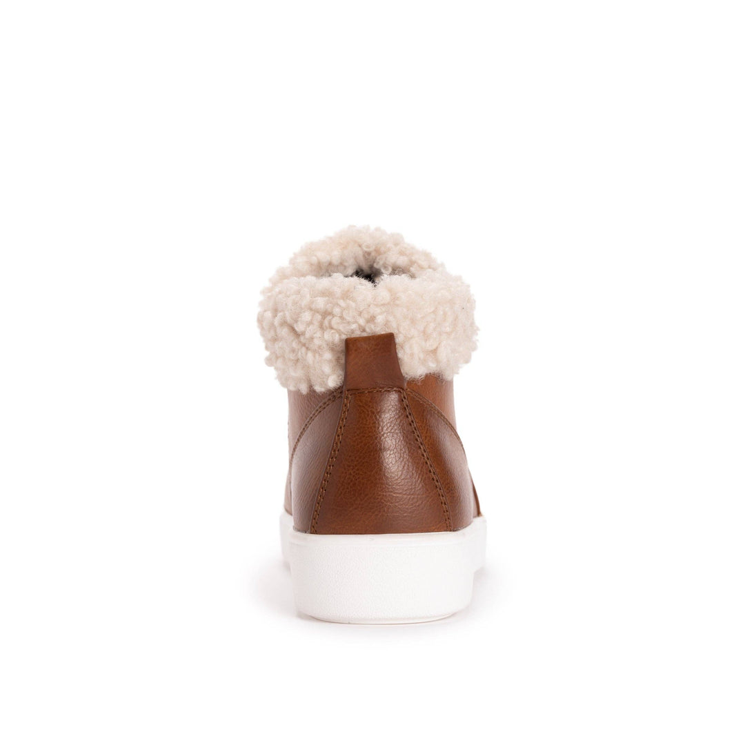A single brown leather high-top sneaker shown from the back, featuring a thick white sole and a fluffy cream shearling-style collar, set against a plain white background.