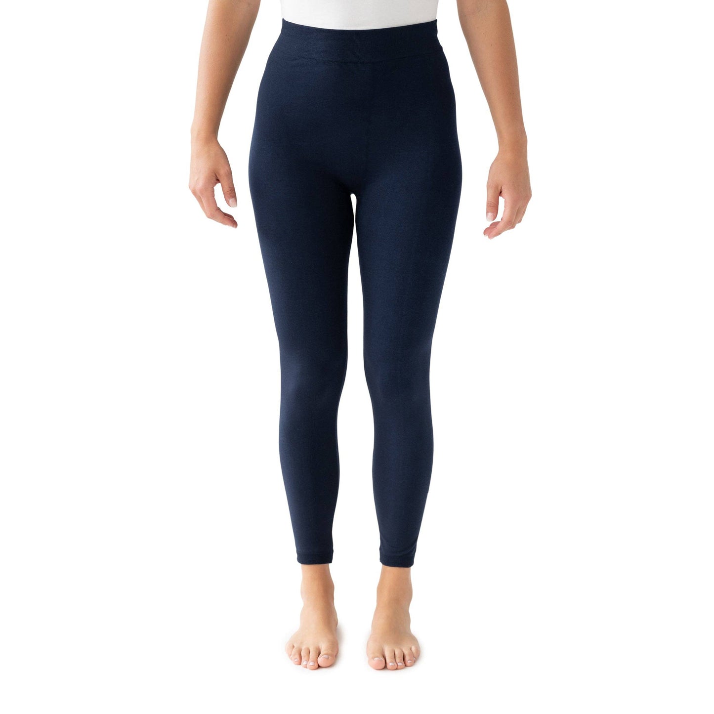 Navy leggings worn by a person on a white background