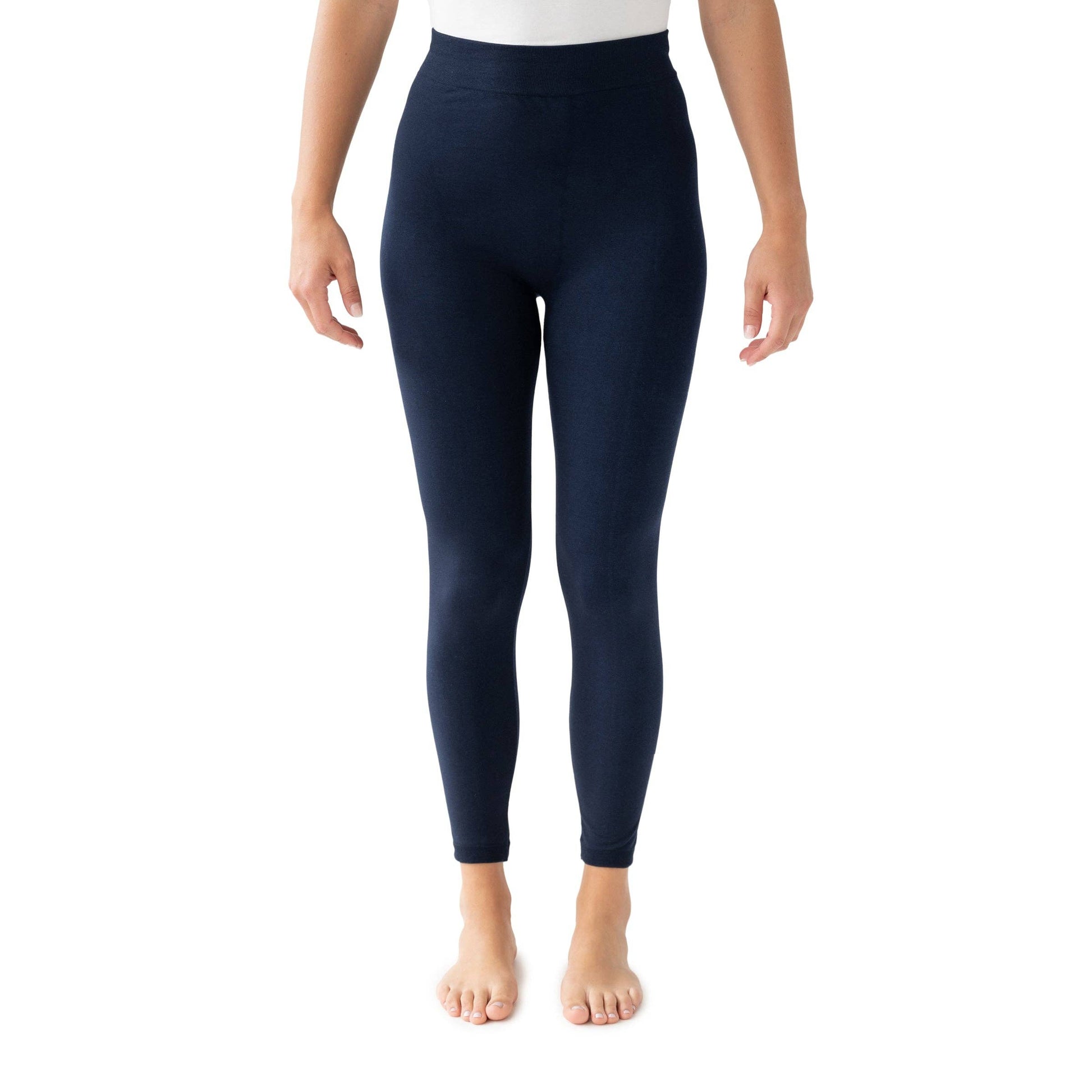 Navy leggings worn by a person on a white background