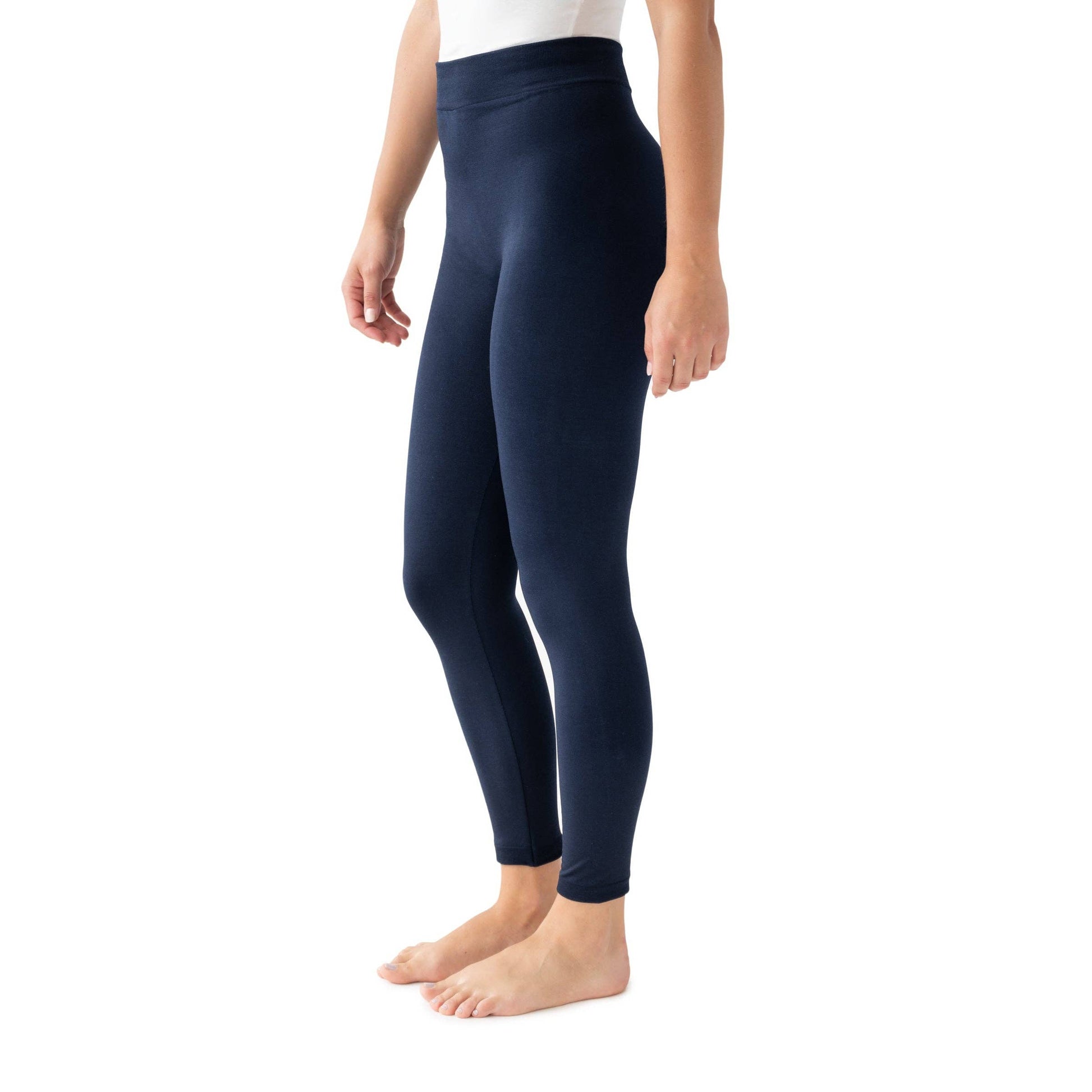Navy blue leggings worn by a person on a white background