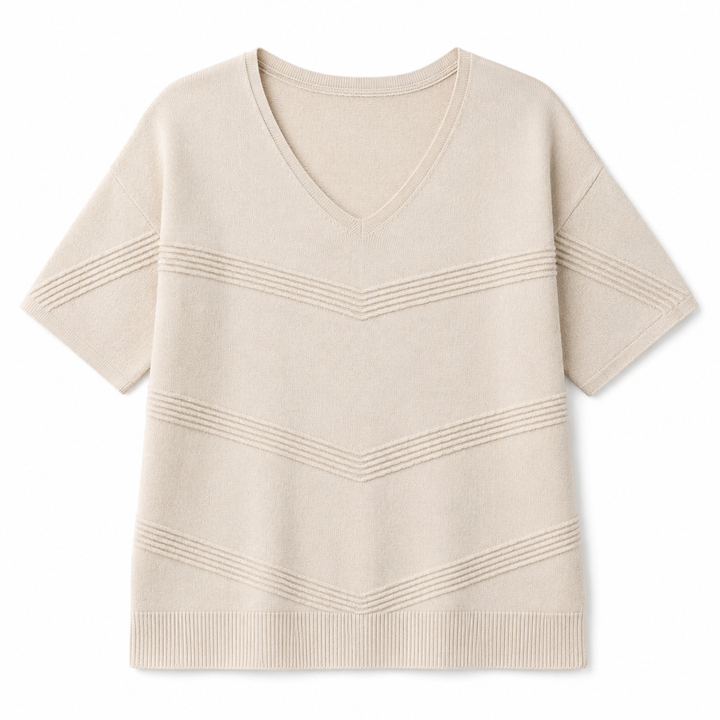 A short-sleeve knit V-neck sweater in a light cream or oatmeal color, featuring horizontal ribbed chevron patterns across the chest and sleeves, displayed on a clean white background.