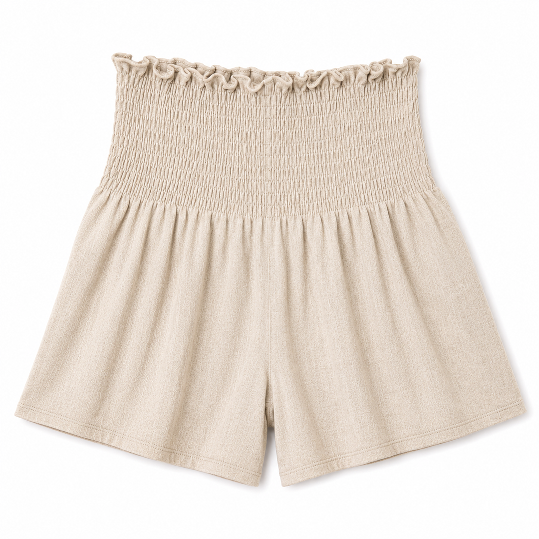 Beige shorts with ruffled waistband on a white background