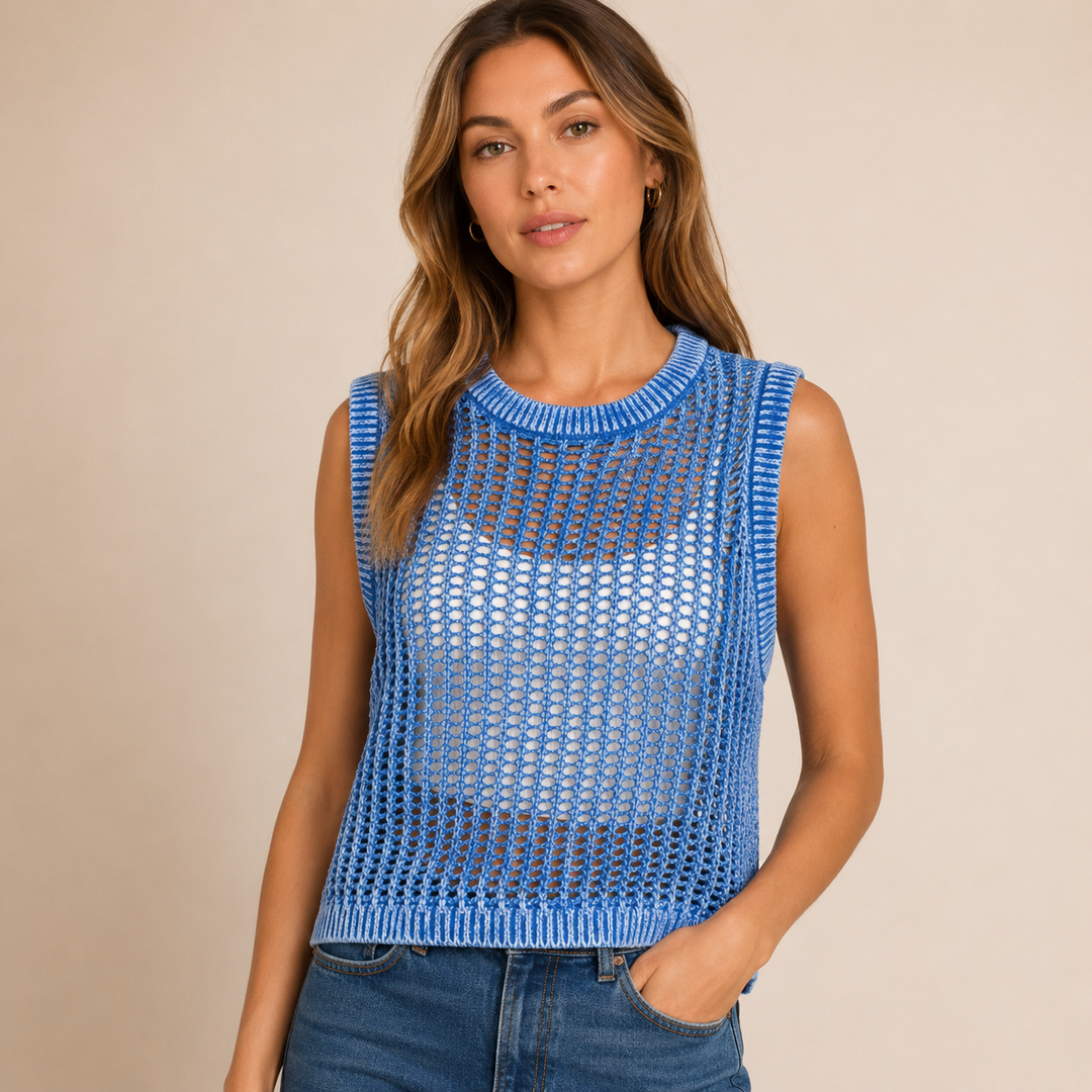 Woman wearing a blue sleeveless knit top against a beige background
