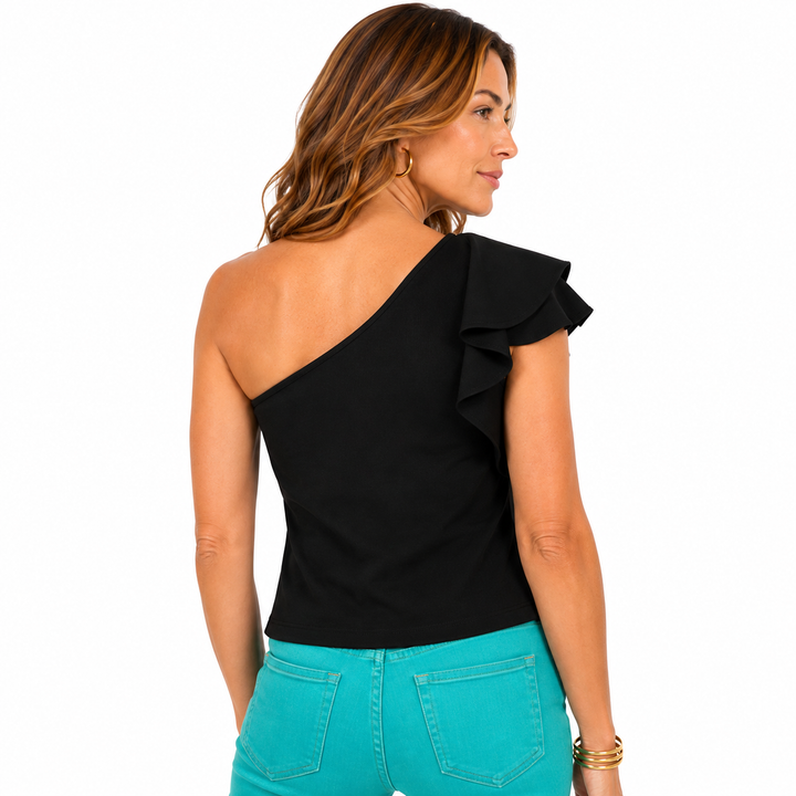 A woman shown from the back wearing a black one-shoulder ruffle top and bright turquoise jeans against a plain white background.