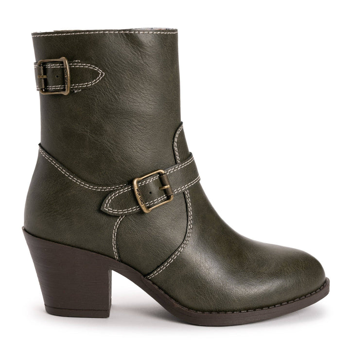 An olive green faux-leather ankle boot with a block heel, featuring decorative straps and brass-tone buckles on the sides, shown against a plain white background.