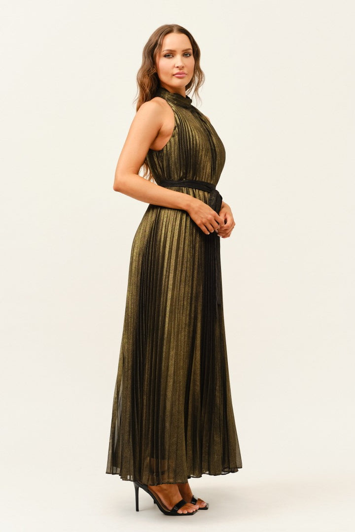 Woman wearing a olive pleated dress on a white background