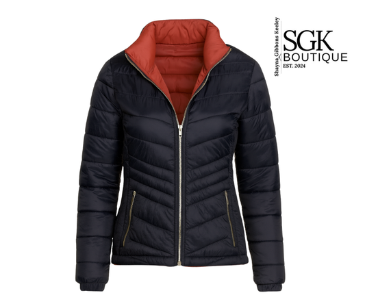 Navy puffer jacket with orange interior on a white background, featuring SGK Boutique logo.