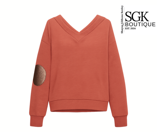 Rust sweatshirt with gold elbow patch on a white background, featuring SGK Boutique logo.
