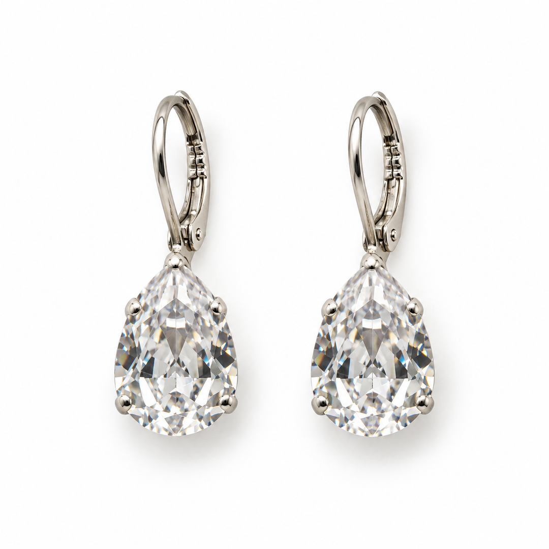 A pair of pear-cut diamond drop earrings in silver leverback settings, shown on a clean white background.