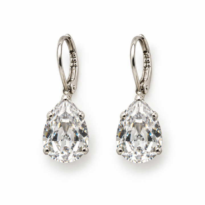A pair of pear-cut diamond drop earrings in silver leverback settings, shown on a clean white background.