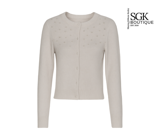 Ivory cardigan with star patterns on a white background, featuring the SGK Boutique logo.