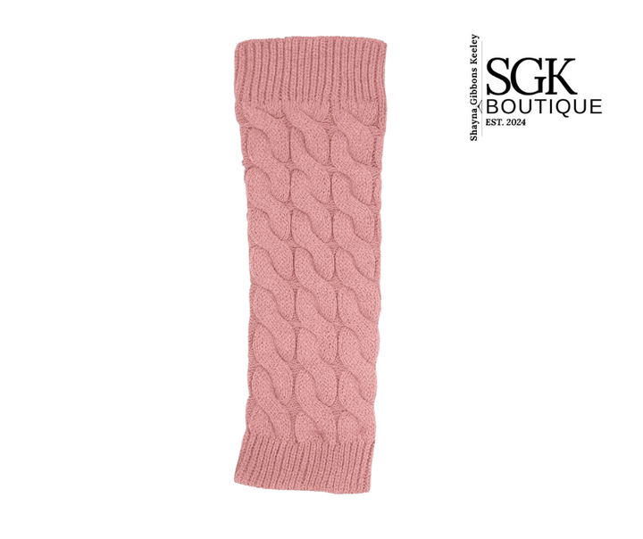 Pink cable knit legwarmer on a white background with SGK Boutique logo.