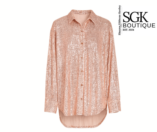 Pink patterned shirt on a white background with SGK Boutique logo.
