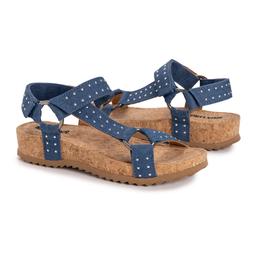Pair of blue sandals with cork soles on a white background